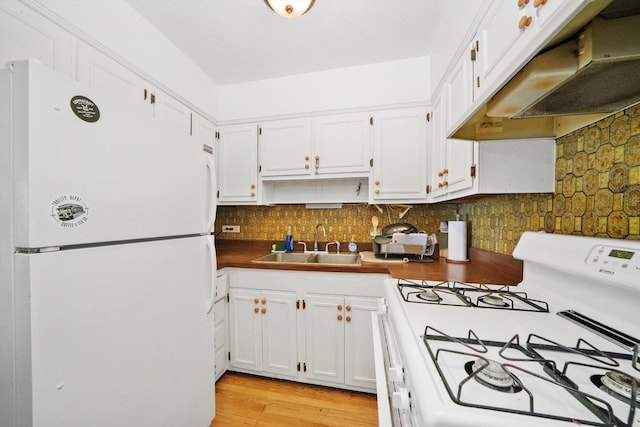 kitchen featuring decorative backsplash, white appliances, sink, light hardwood / wood-style flooring, and white cabinets