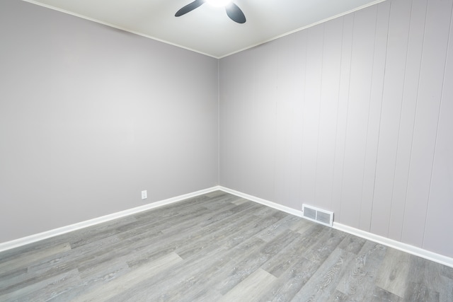 empty room with ceiling fan and light wood-type flooring