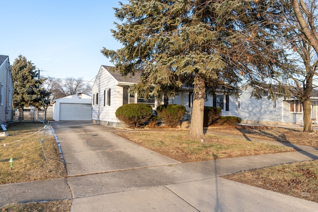 view of front of property with a garage and an outdoor structure