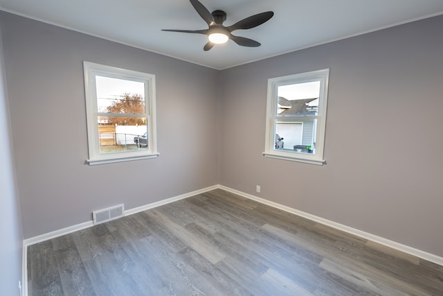 unfurnished room with hardwood / wood-style floors and ceiling fan