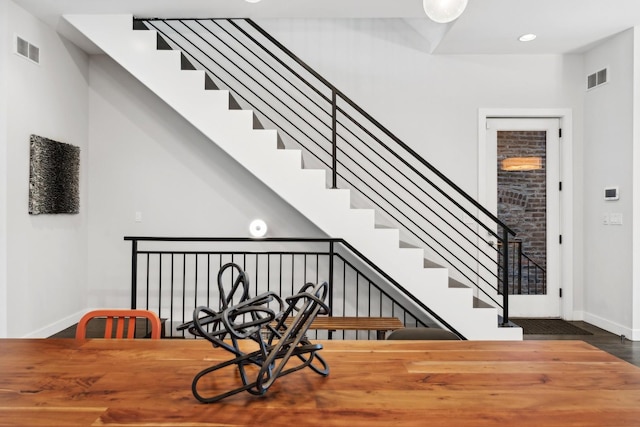 stairs featuring wood-type flooring