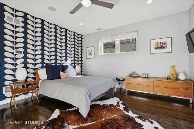 bedroom with ceiling fan and dark hardwood / wood-style floors