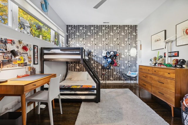 bedroom with dark wood-type flooring