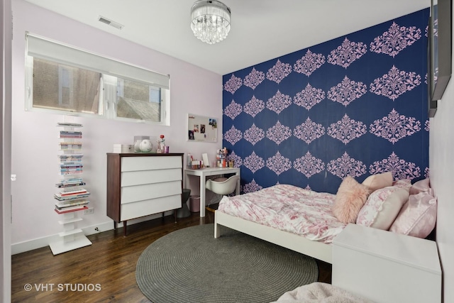 bedroom with dark hardwood / wood-style floors