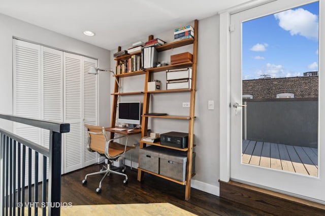 home office with dark hardwood / wood-style floors