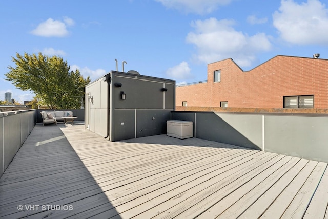 wooden terrace featuring outdoor lounge area