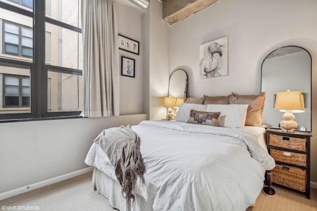 bedroom featuring light carpet