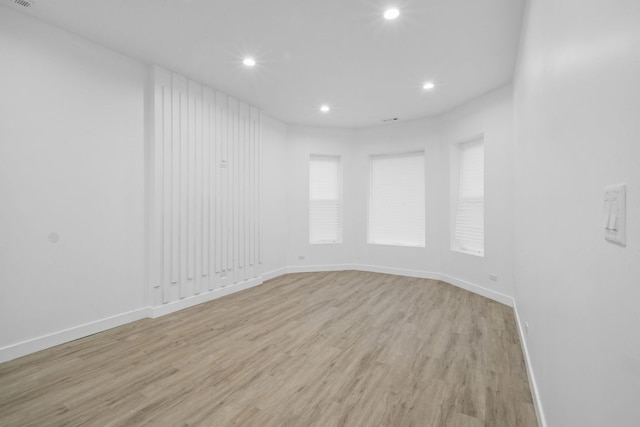 unfurnished room featuring light wood-type flooring