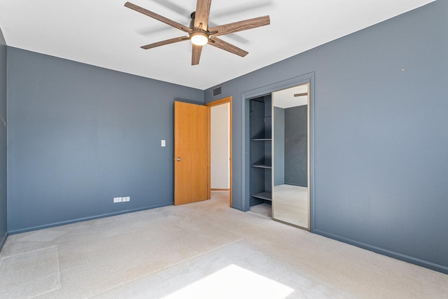 unfurnished bedroom with baseboards, visible vents, a ceiling fan, carpet flooring, and a closet