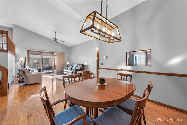 dining area featuring lofted ceiling, ceiling fan, and light hardwood / wood-style floors