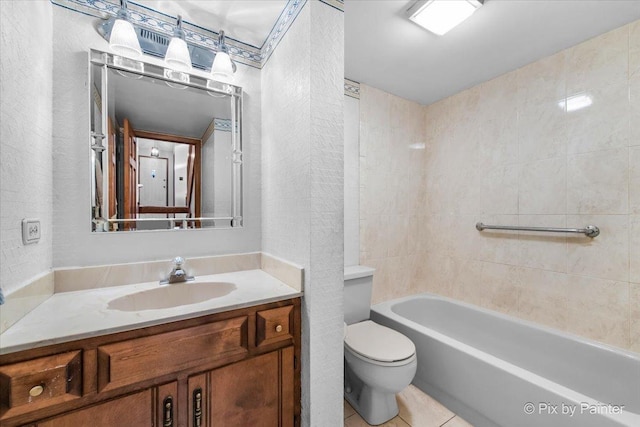 full bathroom featuring toilet, shower / bath combination, tile patterned floors, and vanity