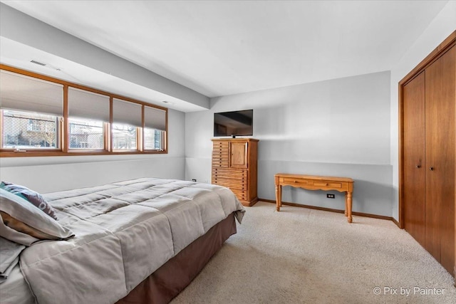 carpeted bedroom featuring a closet