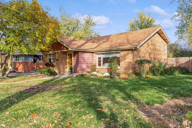 ranch-style house featuring a front yard