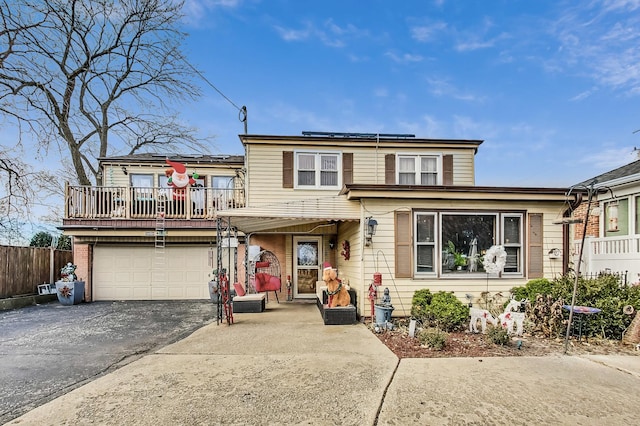 view of front of home featuring solar panels and a garage