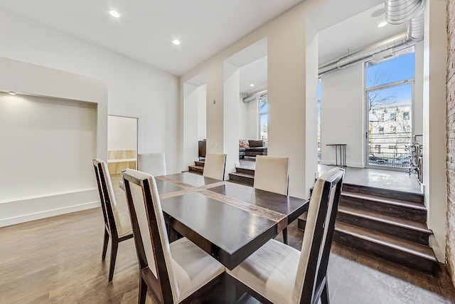 dining area with hardwood / wood-style flooring