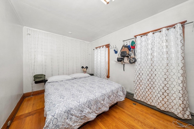 bedroom featuring hardwood / wood-style floors