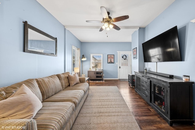 living room with dark hardwood / wood-style floors and ceiling fan