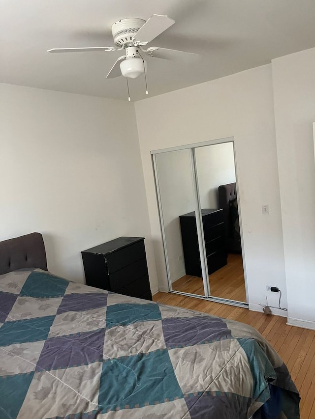 bedroom featuring ceiling fan and wood-type flooring