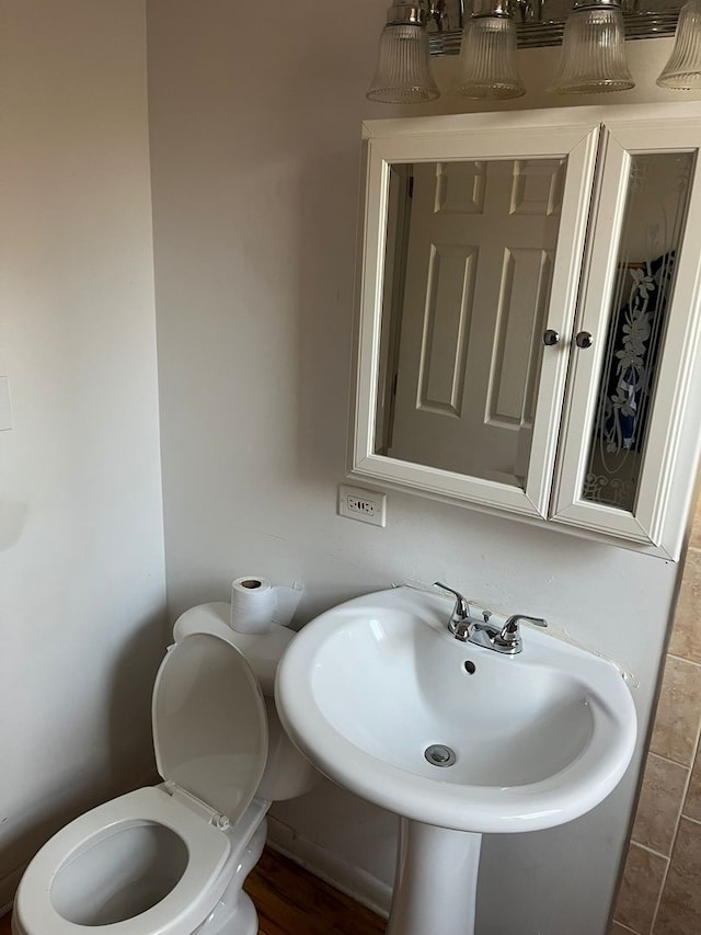 bathroom featuring toilet and sink