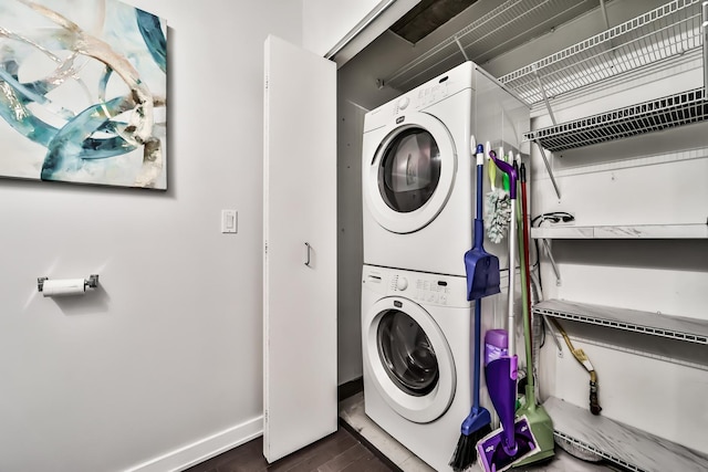 611 S Wells St Unit 1903, Chicago, IL 60607 - laundry room featuring estacked washer and dryer and dark wood finished floors