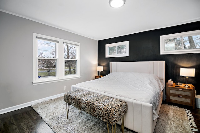 bedroom with dark wood-type flooring