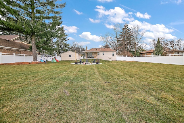 view of yard with a patio and a playground