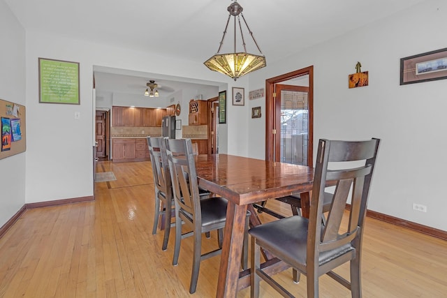 dining area featuring ceiling fan and light wood-type flooring