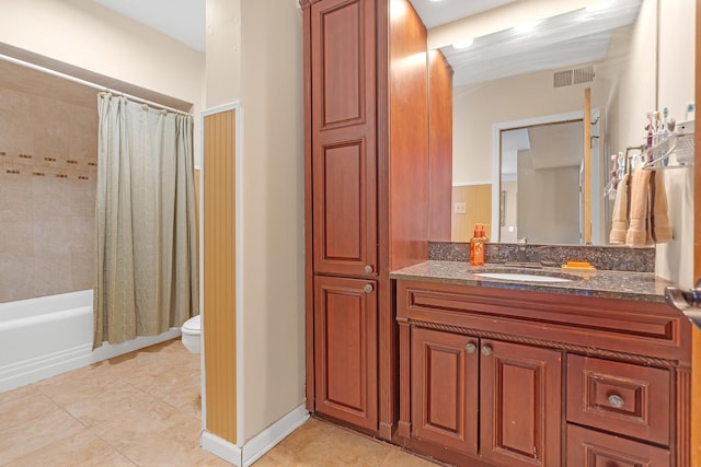 full bathroom with shower / bath combo with shower curtain, toilet, vanity, and tile patterned flooring