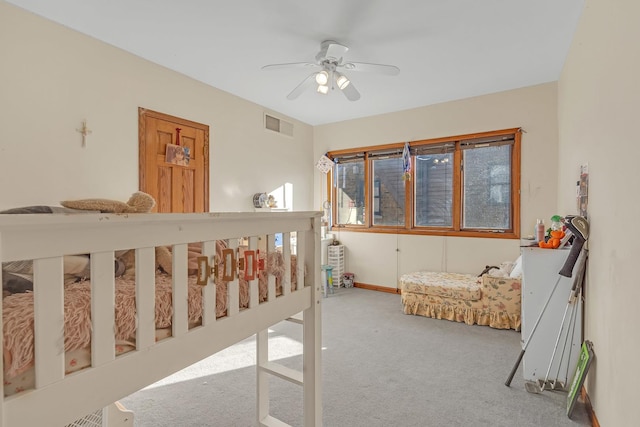 carpeted bedroom with ceiling fan