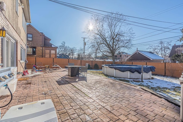 view of patio with a covered pool