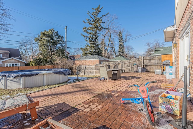 view of patio with a covered pool