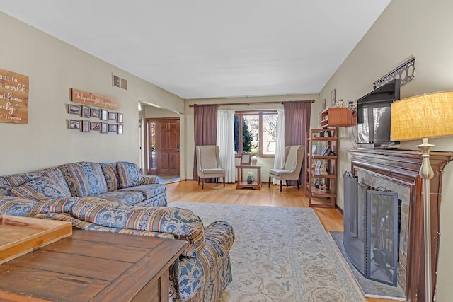 living room with light hardwood / wood-style flooring