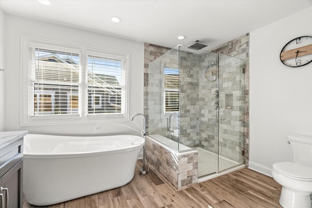 full bathroom with vanity, separate shower and tub, toilet, and wood-type flooring