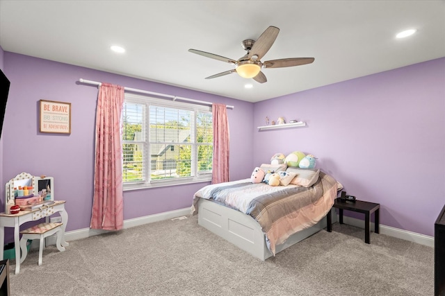 carpeted bedroom featuring ceiling fan