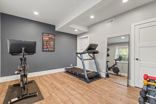 workout room with wood-type flooring