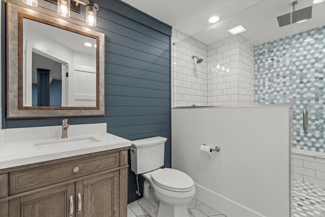 bathroom with vanity, toilet, and walk in shower