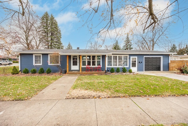 single story home featuring a front yard and a garage