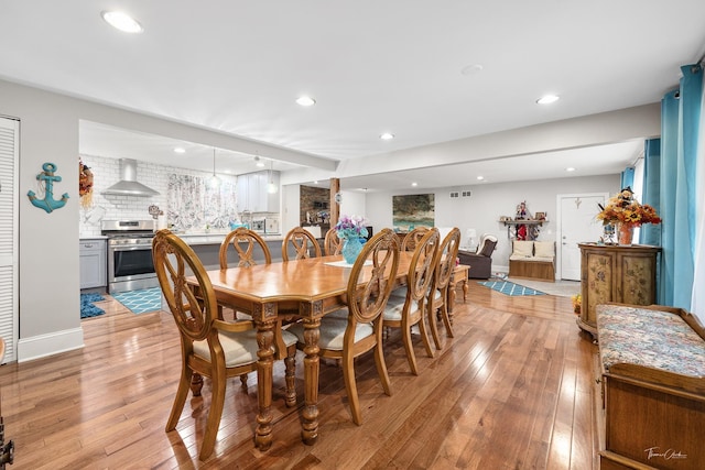 dining area with light hardwood / wood-style floors