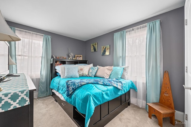 bedroom with light colored carpet