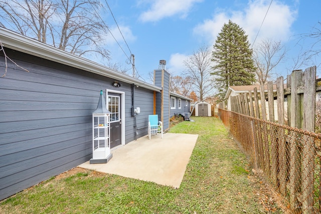 view of yard with a patio area and a shed