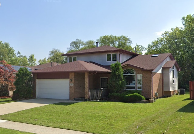 17617 Central Park Ave, Hazel Crest, IL 60429 - view of front of property featuring a front yard, a garage, and central air condition unit