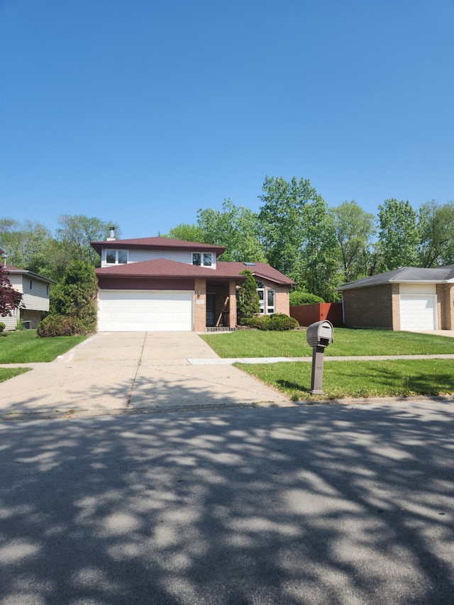 17617 Central Park Ave, Hazel Crest, IL 60429 - view of front facade with a garage and a front yard