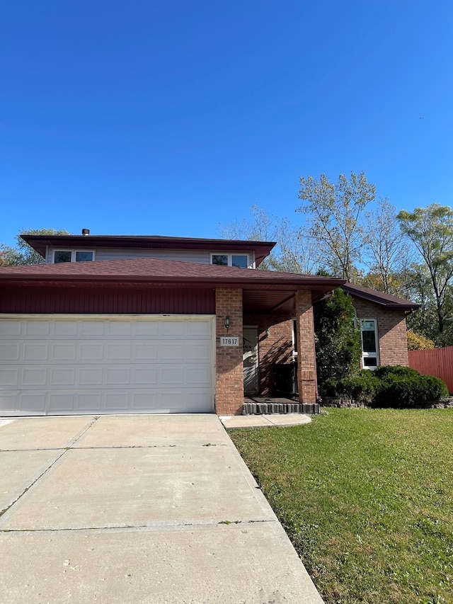 17617 Central Park Ave, Hazel Crest, IL 60429 - view of front of home featuring a front yard and a garage
