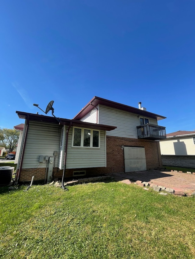 17617 Central Park Ave, Hazel Crest, IL 60429 - rear view of house with a balcony and a yard