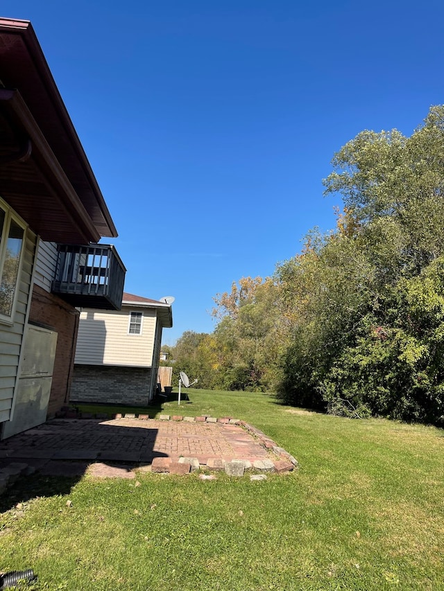 17617 Central Park Ave, Hazel Crest, IL 60429 - view of yard featuring a balcony and a patio