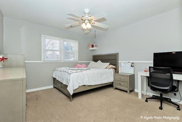 bedroom with ceiling fan and light carpet