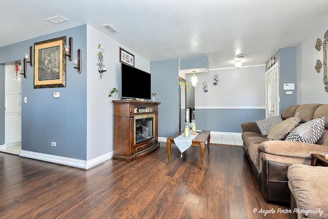 living room featuring dark hardwood / wood-style flooring