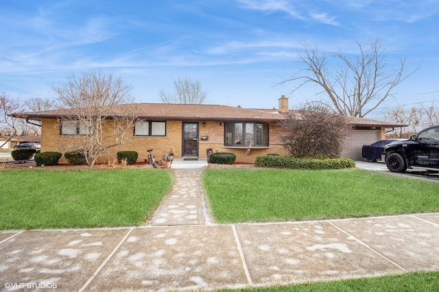 ranch-style house featuring a front yard and a garage