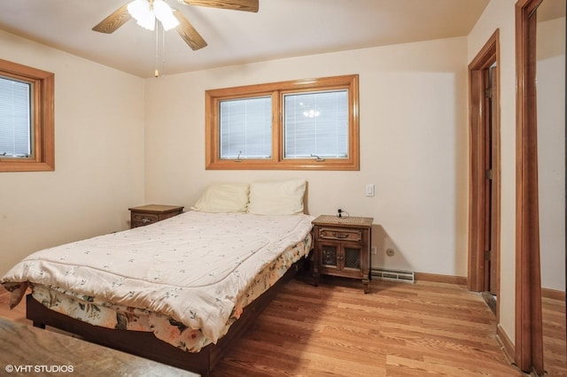 bedroom featuring wood-type flooring and ceiling fan