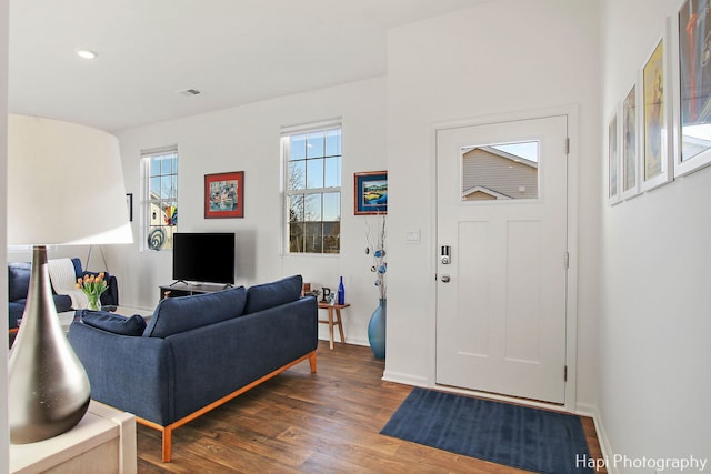 entryway with dark wood-type flooring